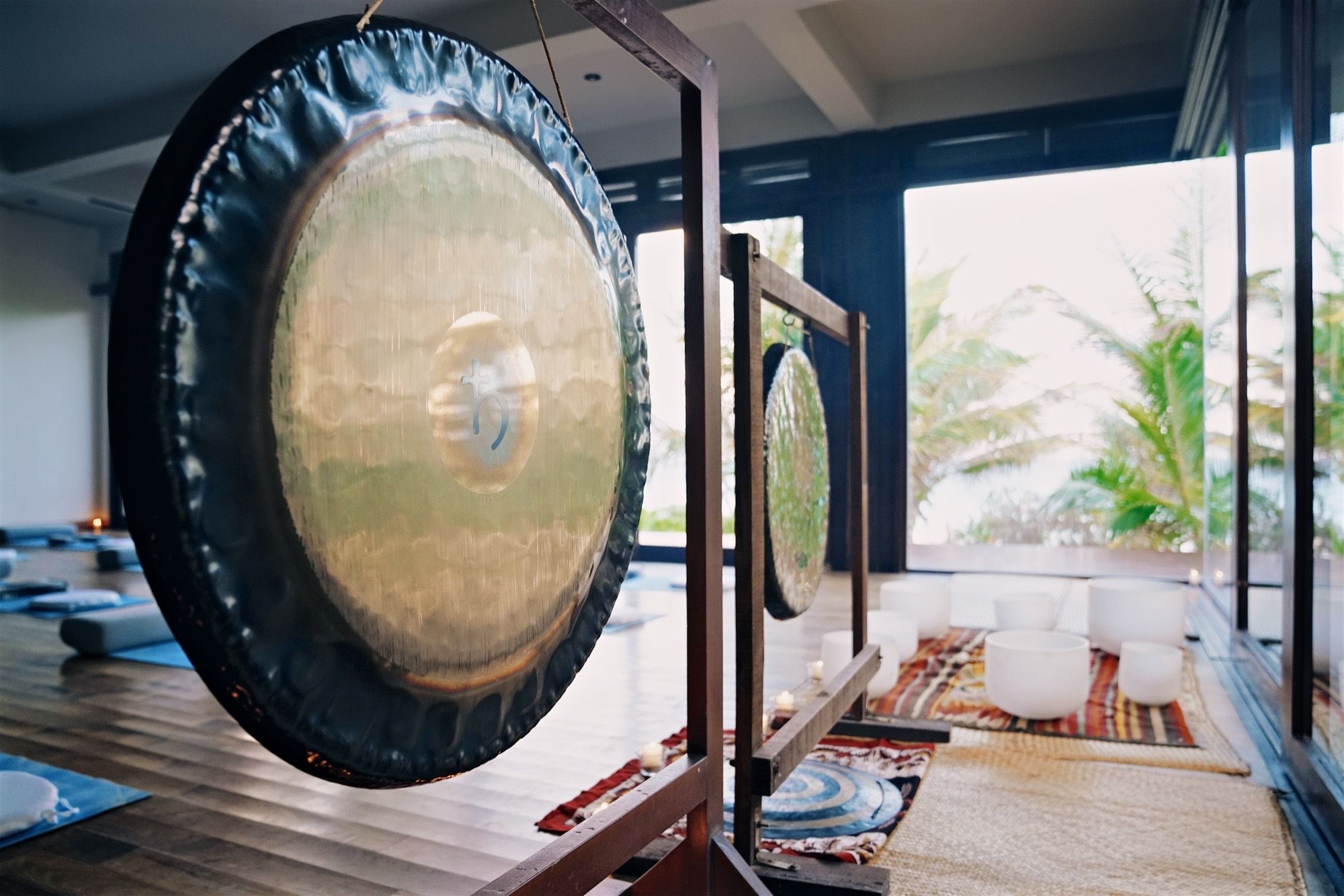 A gong in the shala, the sea beyond