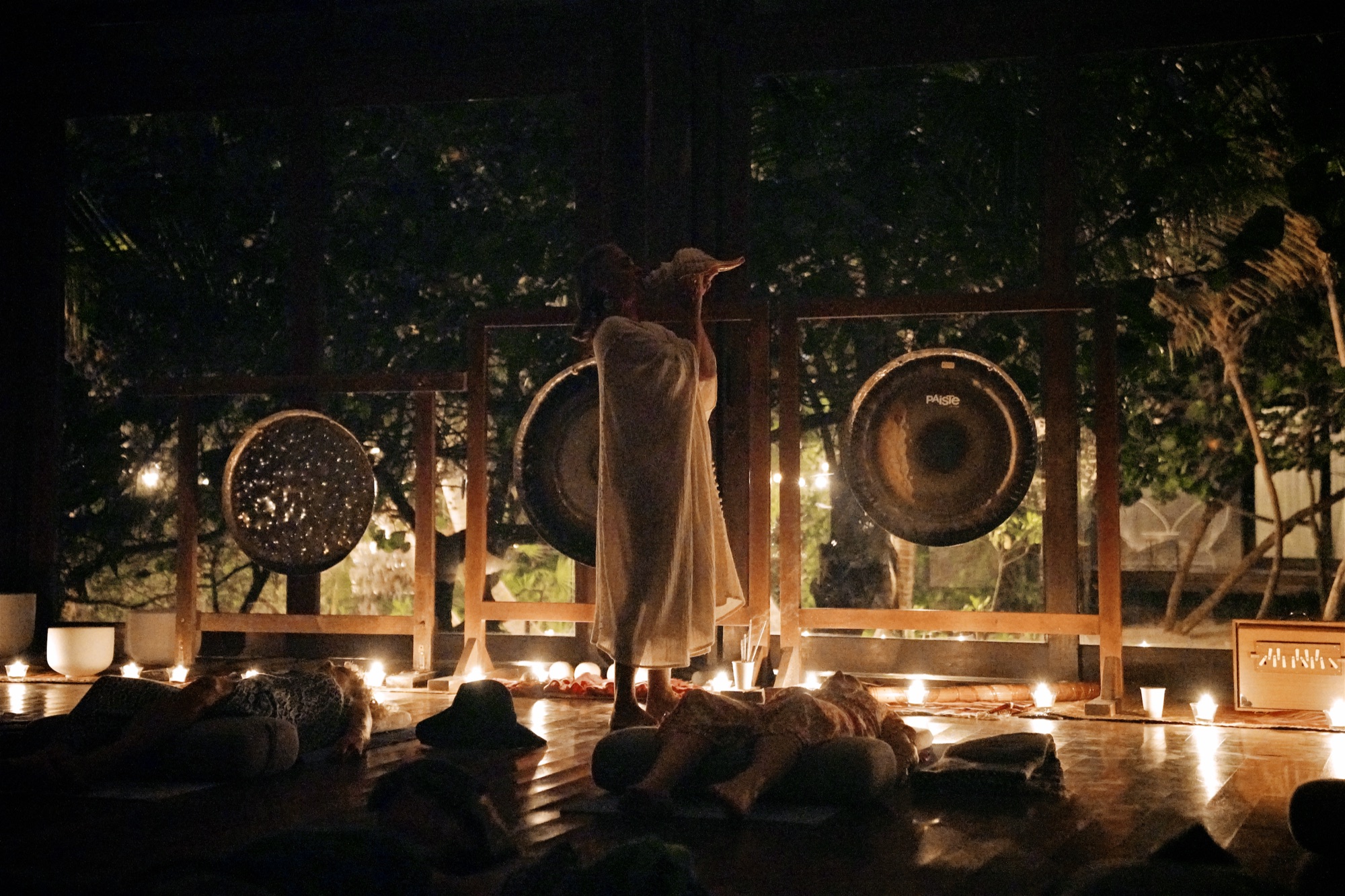 Sound healing at night, the gongs lit by candles